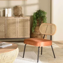 Fauteuil métal noir assise velours orange ambré dossier rotin